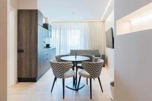 a living room with a table and chairs in a room at Ca Gracia Bocairent in Bocairent +49 photos