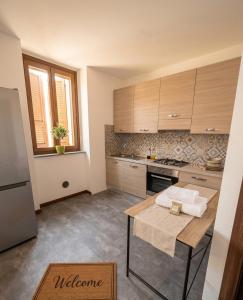 a kitchen with a table in the middle of it at a casa di ASIA in Dalmine +4 photos