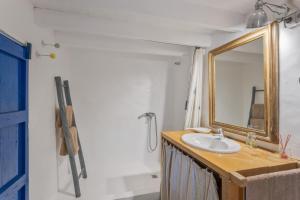 a bathroom with a sink and a mirror at Can Vicent in Illes Balears