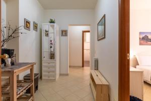 a room with a bed and a desk and a bedroom at Ragusa 59 in Ragusa