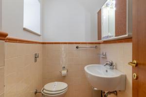 a bathroom with a toilet and a sink at Ragusa 59 in Ragusa +15 photos