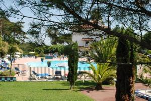 a view of a swimming pool in a resort at Charmant Appartement - Bordaberry in Urrugne