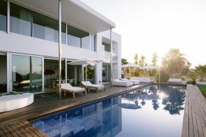 an exterior view of a house with a swimming pool at Villa 10 9 in Sant Josep +22 photos