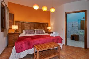 a bedroom with a large bed and a bathroom at Group Villa 14 Pool Beach 10 minute in Frigiliana +31 photos
