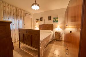 a bedroom with a large bed in a room at Huerta del Sol in Aracena +36 photos