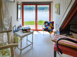 a room with a desk and a window with a view at Le Balcon De Loire in La Chapelle-sur-Loire