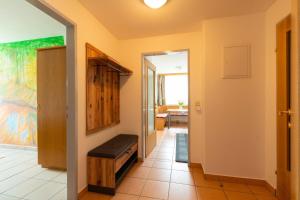 a hallway with a door leading into a room at Appartment Isabelle Terra in Lake Pressegg +34 photos