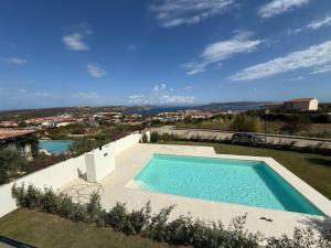 a swimming pool in the middle of a yard at Smeraldo Apartment in Palau
