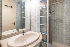 a bathroom with a sink and a shower at Le Domaine du Lary in Saint-Lary-Soulan +11 photos