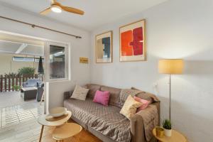 a living room with a couch and a table at Maspalomas Green Oasis in San Bartolomé