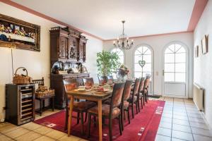 a dining room with a table and chairs at Ferienwohnung 1 in Bernkastel-Kues