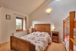 a bedroom with a bed and a bunk bed at Maison Dans Ancienne Forge in Noyarey +17 photos