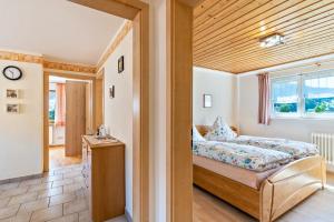 a bedroom with a bed and a window at Brujosenhof in Oppenau