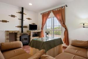 a living room with a couch and a glass table at Villa Perez Zara Carmelo in Campano