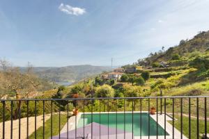 a view of a swimming pool from the balcony of a house at Casa Do Alago in Gove