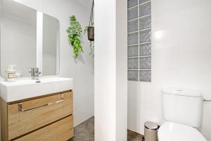 a bathroom with a sink and a toilet at Ca L'Oliera in Denia