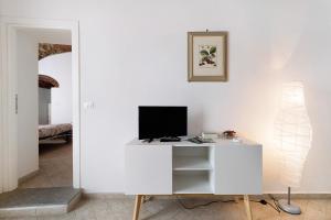 a white desk with a computer on it in a room at Ciliegio Agriturismo La Ferla in Toirano
