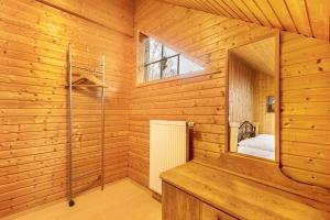 a sauna with a window in a wooden cabin at Blockhaus Marie in Frielendorf +35 photos