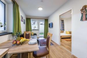 a dining room with a table with fruit on it at Ferienwohnung Unterlechner - Apt 1 in Vomp