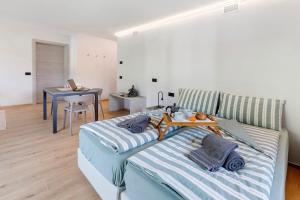 a bedroom with a bed with a tray on it at Chalet Ale Livigno in Livigno