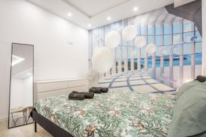 a bedroom with a bed and a large window at Las Américas Seafront - Free Wi-fi in Playa de las Americas