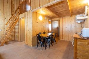 a dining room with a table and chairs at Bungalow Alós in Alós de Balaguer