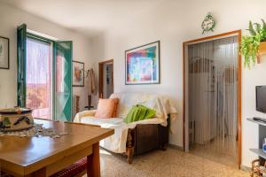 a living room with a couch and a table at Trullo Nunuccio in Ceglie Messapica