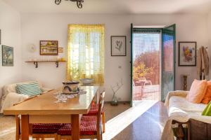 a living room with a table and a couch at Trullo Nunuccio in Ceglie Messapica