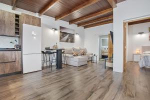 a living room with a couch and a table at El Refugio De Los sueños in Uga +13 photos