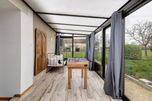 a room with a table and a window at Gîte Du Parc in La Celle-Saint-Avant +19 photos