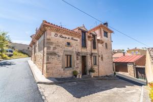 an old building on the side of a road at El Rincón de Hornuez in Moral