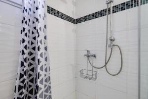 a bathroom with a shower with a shower curtain at Gite du maine in Langon +16 photos