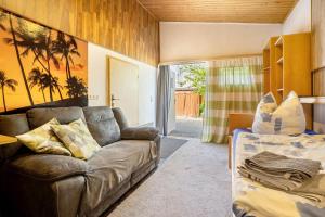 a living room with a couch and a bed at Ferienwohnung mit Aufenthaltsraum in Ruhland