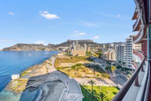 a view from a balcony of a city and the ocean at Calpe Vistas y Playa in Calpe