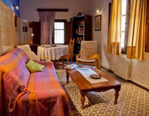 a living room with a couch and a table at Casa Jara in Azuara