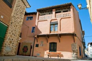 a building with a picnic table in front of it at Casa Jara in Azuara