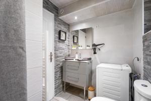 a bathroom with a toilet and a sink at Villa Nui in Cuers +12 photos
