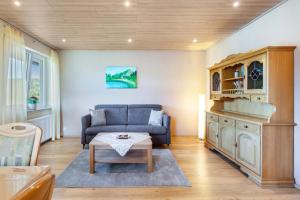 a living room with a couch and a table at Triberg Blick in Triberg