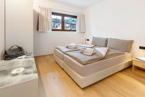 a bedroom with a large bed in a room at Chalet Ale Livigno in Livigno +72 photos