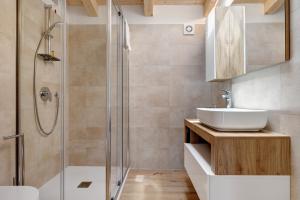 a bathroom with a shower and a sink at Jacky's Apartments in Limone sul Garda +39 photos