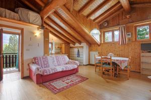 a living room with a couch and a table at Piccolo Paradiso in Cogne
