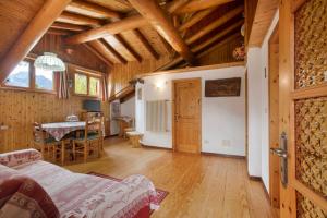 a room with a bed and a table in a building at Piccolo Paradiso in Cogne +20 photos