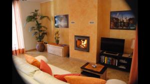 a living room with a couch and a fireplace at Gorgeous 1 double bedroom apartment in Bellagio