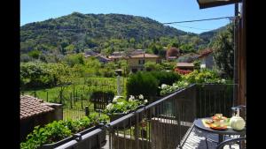 a balcony with a view of a mountain at Gorgeous 1 double bedroom apartment in Bellagio