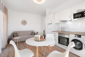 a kitchen and living room with a table and chairs at Salitre in Las Eras +19 photos