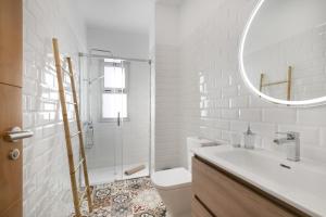 a bathroom with a toilet and a sink and a mirror at Salitre in Las Eras