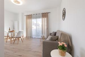 a living room with a couch and a table at Salitre in Las Eras