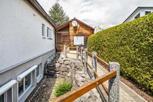a stairway leading to a house with a building at Ferienwohnung Helms in Eriskirch