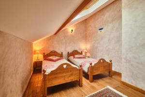 a bedroom with two beds in a room at Chateau De Merande in Arbin