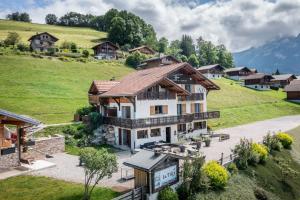 an aerial view of a house in the mountains at Gand chalet montagne 30 personnes in Bernex